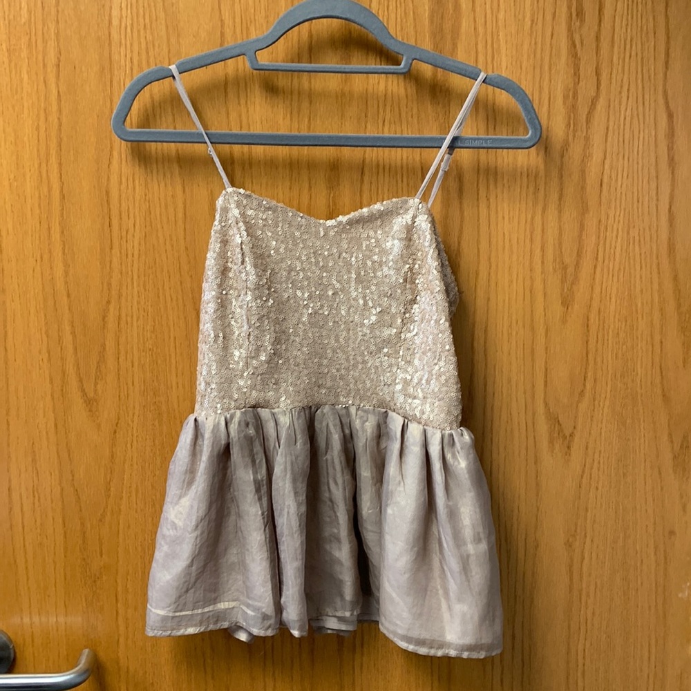 Champagne sequined peplum top
